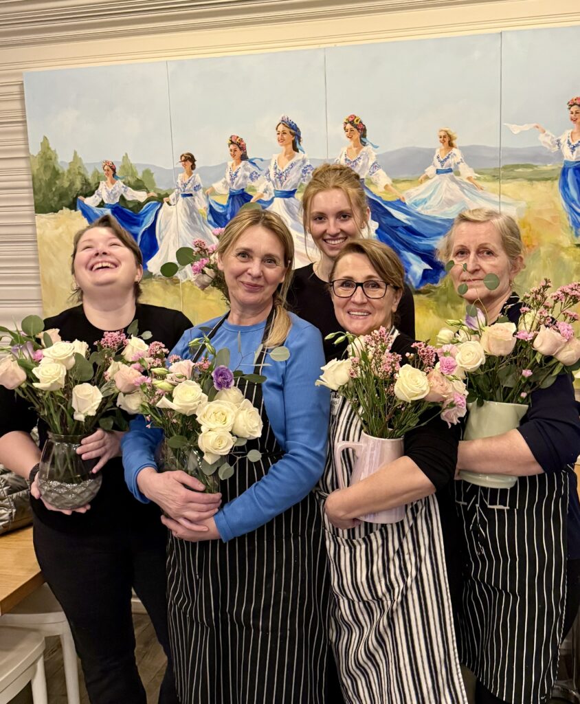Elena celebrates international womens day russia with her staff by giving them flowers