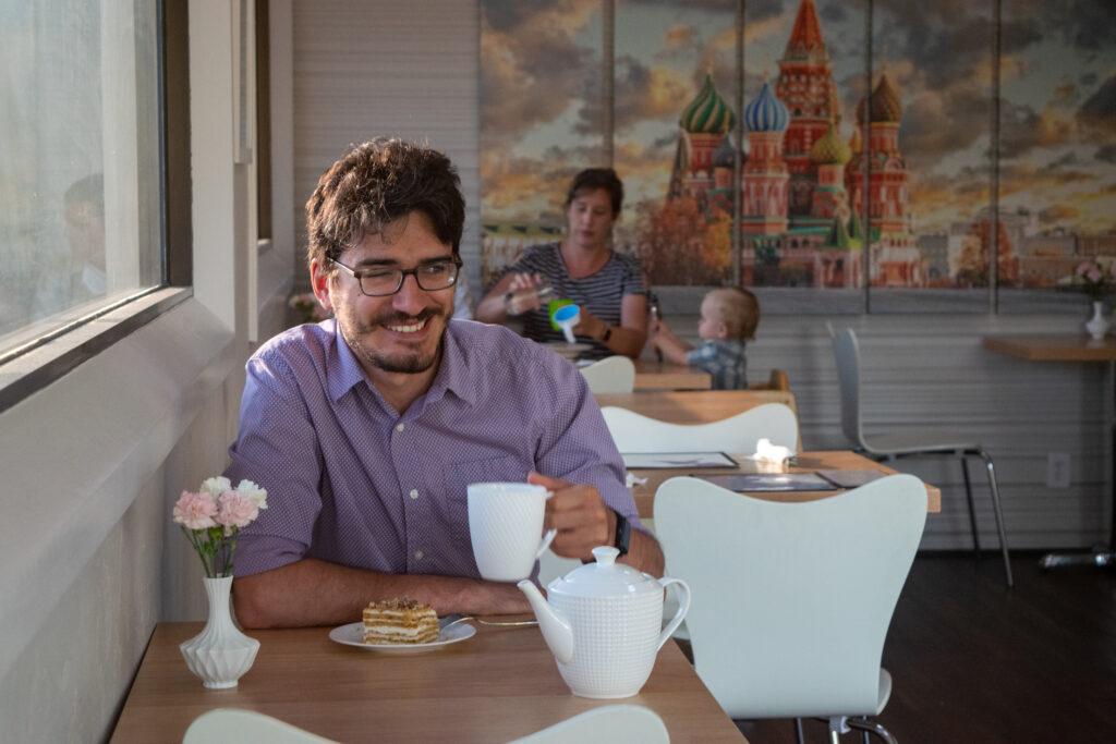 man smiling over Russian tea